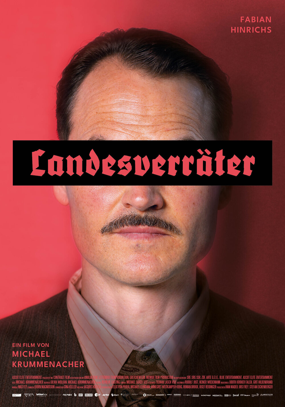 Fabian Hinrichs als August Schmid, Charakterplakat